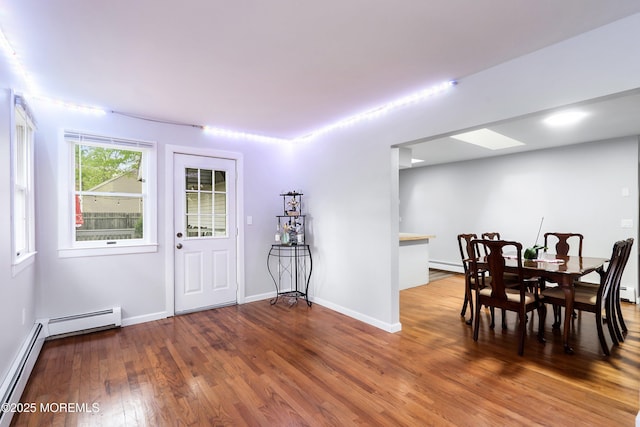 1015 Barnacle Dr, Manahawkin, NJ 08050 - dining space featuring wood finished floors, baseboards, baseboard heating, and a baseboard radiator