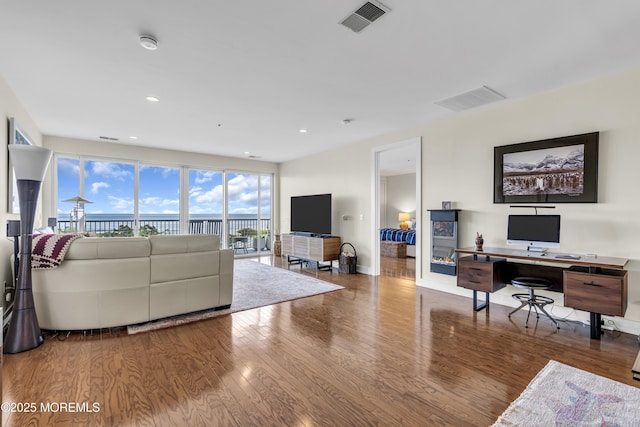 432 Ocean Blvd N Unit 506, Long Branch, NJ 07740 - living room featuring wood finished floors, an office area, baseboards, and recessed lighting
