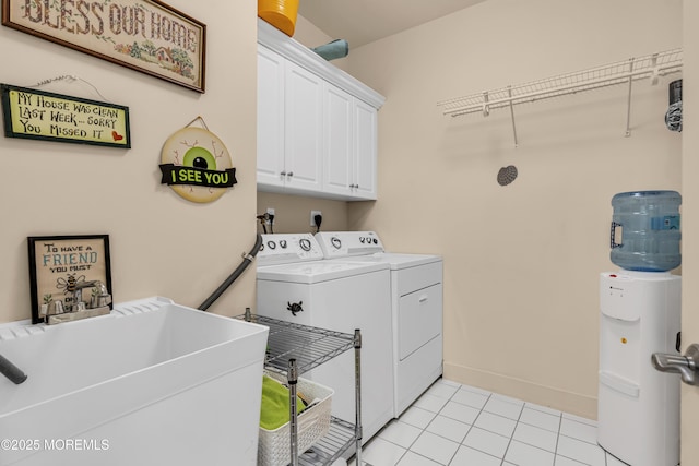 432 Ocean Blvd N Unit 506, Long Branch, NJ 07740 - washroom featuring washer and clothes dryer, cabinet space, light tile patterned floors, and baseboards