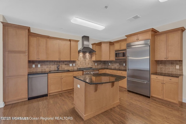 432 Ocean Blvd N Unit 506, Long Branch, NJ 07740 - kitchen with built in appliances, wall chimney range hood, a sink, and wood finished floors