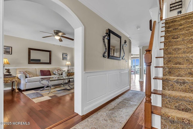 221 Bay Stream Dr, Toms River, NJ 08753 - stairs featuring a ceiling fan, arched walkways, wood finished floors, crown molding, and a wainscoted wall
