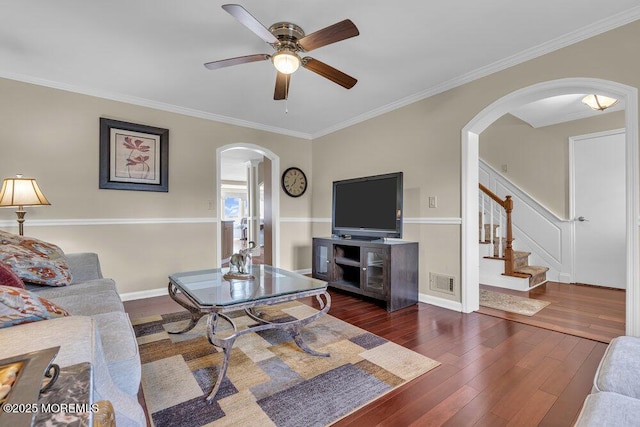 221 Bay Stream Dr, Toms River, NJ 08753 - living room with arched walkways, hardwood / wood-style floors, ceiling fan, stairway, and ornamental molding