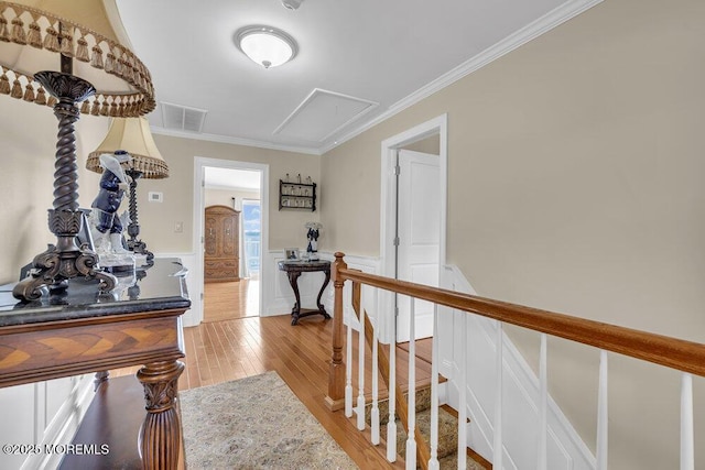 221 Bay Stream Dr, Toms River, NJ 08753 - corridor featuring attic access, an upstairs landing, light wood-style flooring, crown molding, and wainscoting
