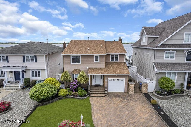 221 Bay Stream Dr, Toms River, NJ 08753 - view of front facade featuring decorative driveway, a residential view, and roof with shingles