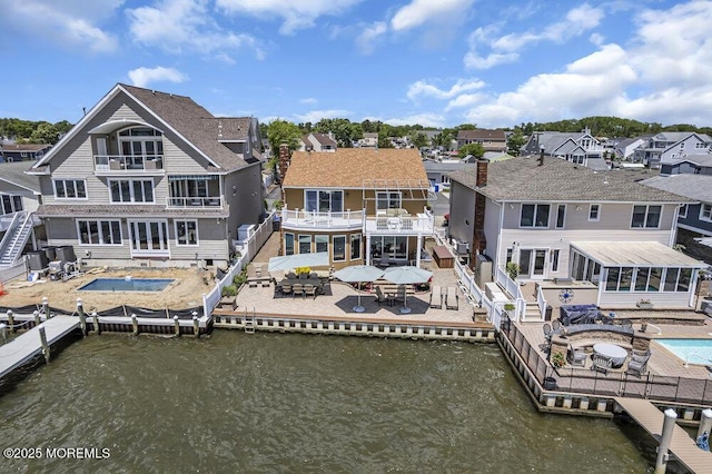 221 Bay Stream Dr, Toms River, NJ 08753 - back of house with a water view, a balcony, a patio area, and a residential view