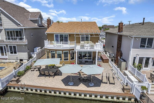 221 Bay Stream Dr, Toms River, NJ 08753 - back of house with a fenced backyard, a patio, a balcony, and outdoor dining area