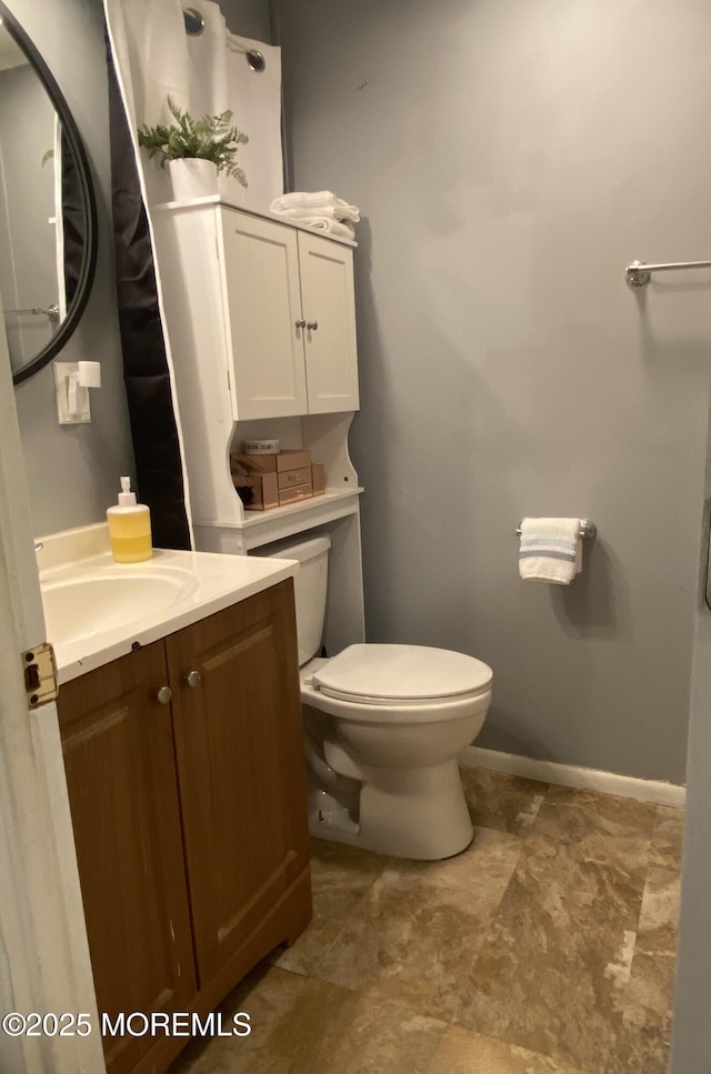 89 Seattle Slew Dr, Howell, NJ 07731 - half bath with toilet, vanity, and baseboards