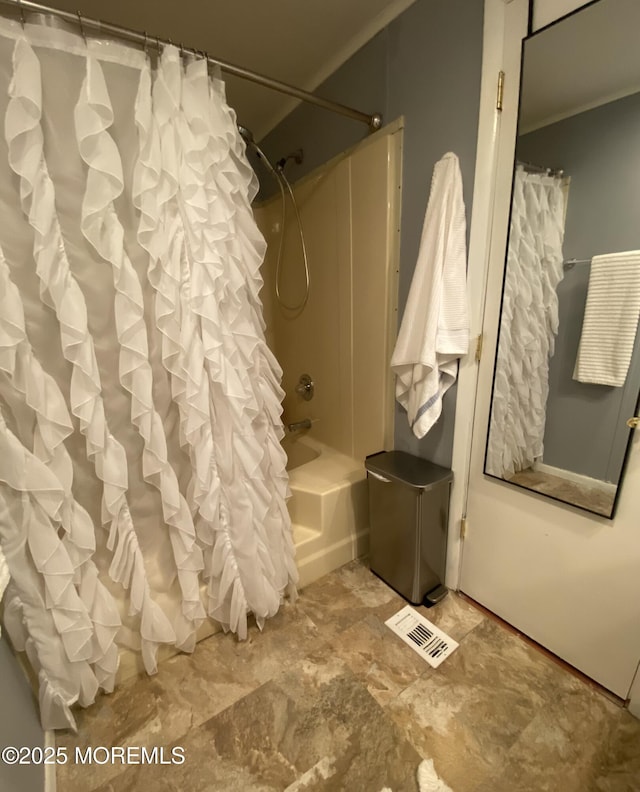 89 Seattle Slew Dr, Howell, NJ 07731 - bathroom with shower / bath combo, ornamental molding, and stone finish flooring