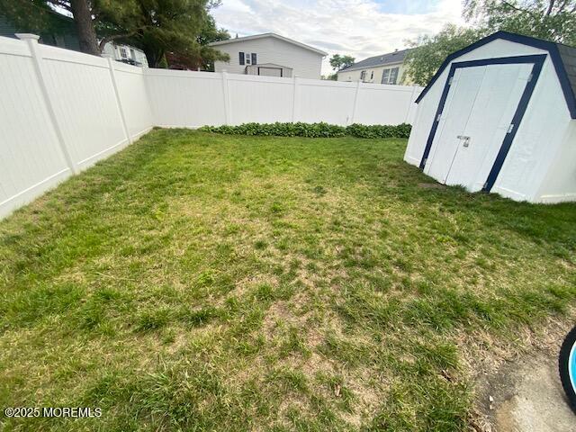 89 Seattle Slew Dr, Howell, NJ 07731 - fenced backyard featuring a storage shed