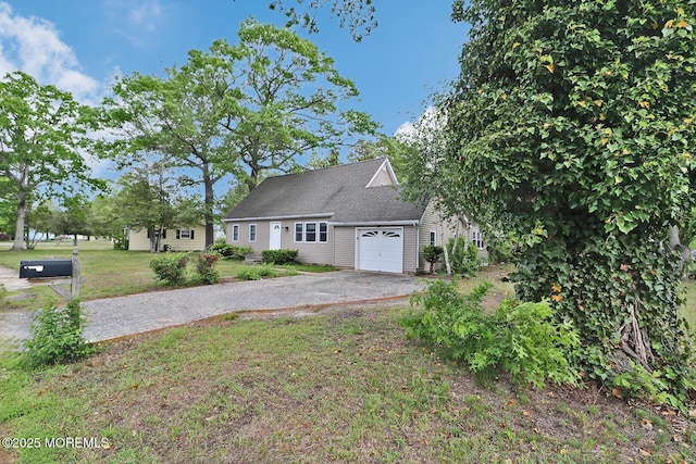 122 Oakwood Pl, Forked River, NJ 08731 - view of front of home featuring driveway, a garage, and a front lawn
