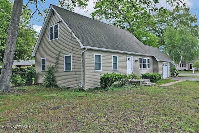 122 Oakwood Pl, Forked River, NJ 08731 - view of front of home featuring a garage, roof with shingles, a front yard, and driveway