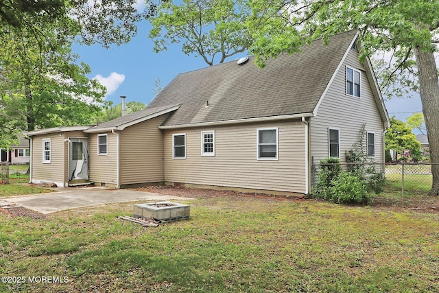 122 Oakwood Pl, Forked River, NJ 08731 - back of property featuring an outdoor fire pit, a patio area, and roof with shingles
