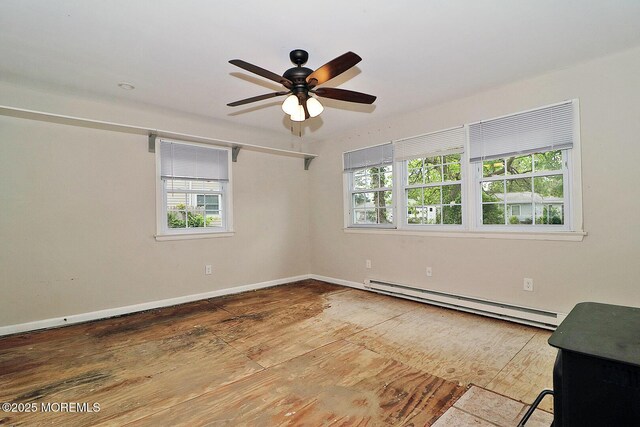 122 Oakwood Pl, Forked River, NJ 08731 - unfurnished room with a baseboard heating unit, ceiling fan, and baseboards