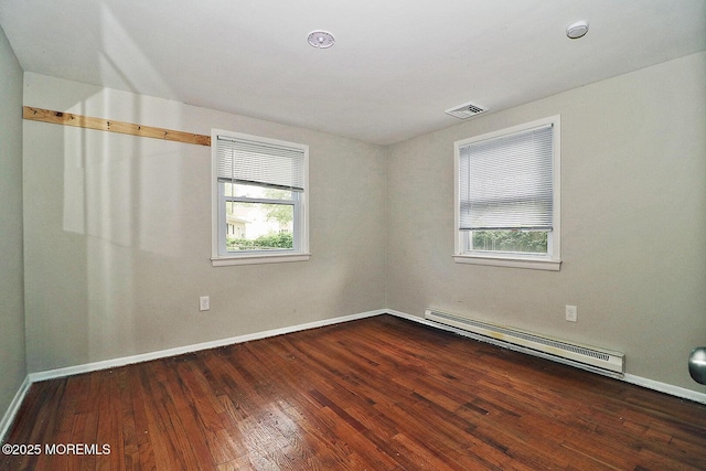 122 Oakwood Pl, Forked River, NJ 08731 - unfurnished room featuring a baseboard radiator, healthy amount of natural light, wood-type flooring, and baseboards