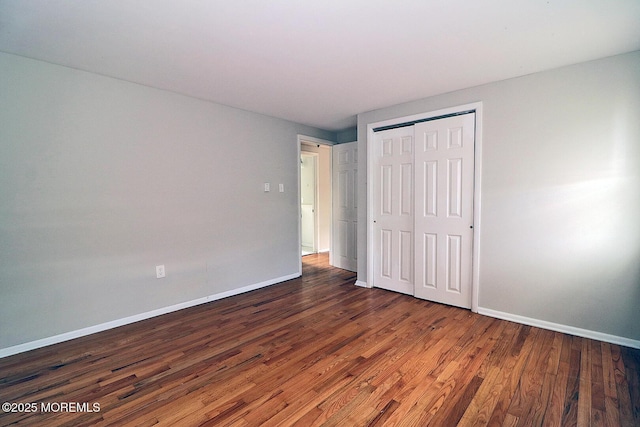 122 Oakwood Pl, Forked River, NJ 08731 - unfurnished bedroom with wood finished floors, baseboards, and a closet