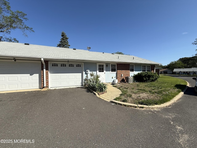 1134A Argyll Cir, Lakewood, NJ 08701 - ranch-style house with an attached garage, central AC, brick siding, and driveway