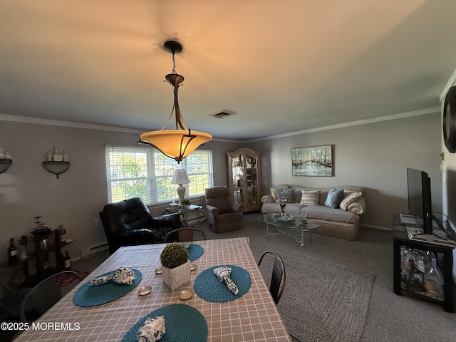 1134A Argyll Cir, Lakewood, NJ 08701 - carpeted dining area featuring a baseboard heating unit and ornamental molding