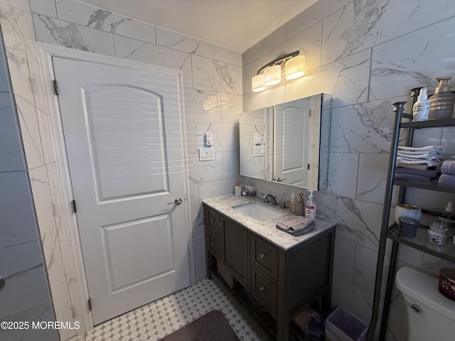 1134A Argyll Cir, Lakewood, NJ 08701 - bathroom with tile walls, vanity, tile patterned floors, and toilet
