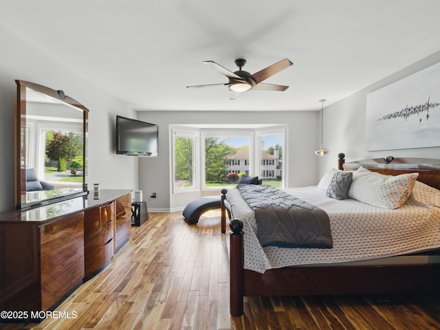 50 Locust Ct, Freehold, NJ 07728 - bedroom featuring multiple windows, light wood-style flooring, and baseboards