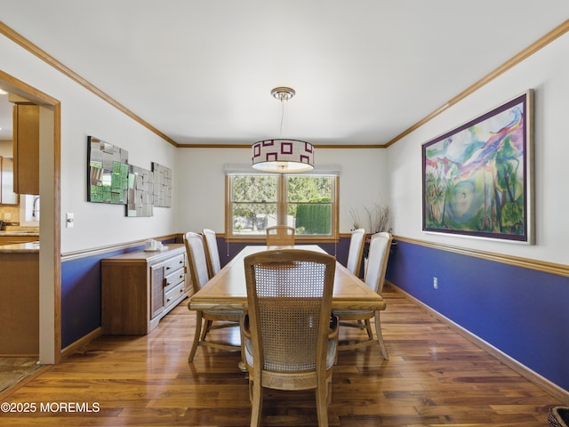 50 Locust Ct, Freehold, NJ 07728 - dining area with wood finished floors, crown molding, and baseboards