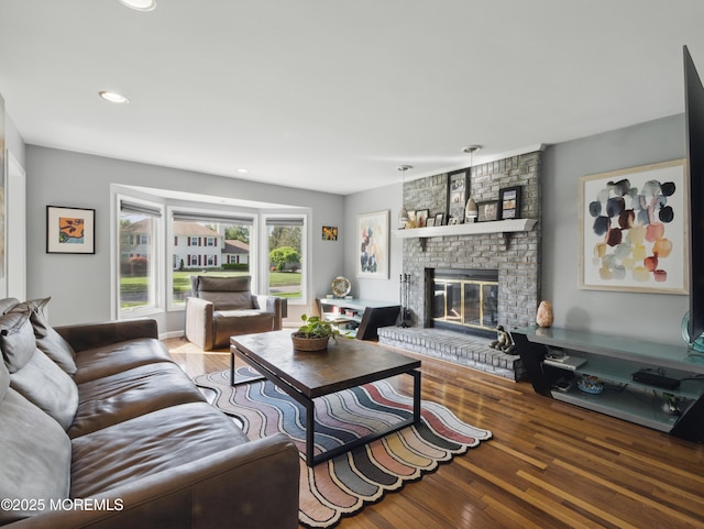 50 Locust Ct, Freehold, NJ 07728 - living room featuring wood finished floors, a brick fireplace, and recessed lighting