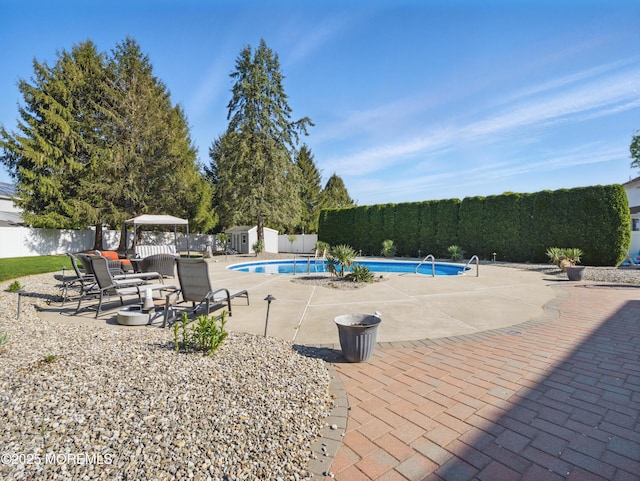 50 Locust Ct, Freehold, NJ 07728 - view of swimming pool featuring a fenced backyard, a patio, and a storage shed