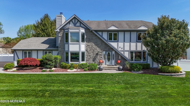 50 Locust Ct, Freehold, NJ 07728 - tudor house featuring a chimney, stone siding, and board and batten siding