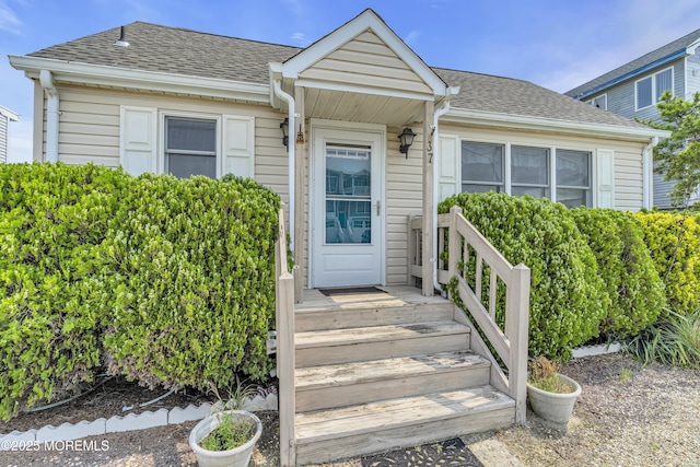 37 N 4th St, Surf City, NJ 08008 - doorway to property featuring roof with shingles