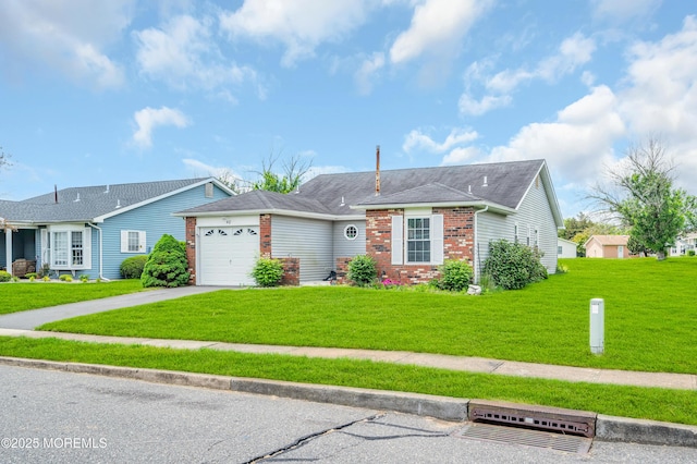 40 Everest Dr N, Brick, NJ 08724 - single story home featuring driveway, brick siding, a garage, and a front lawn