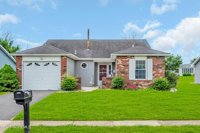 40 Everest Dr N, Brick, NJ 08724 - view of front of home featuring brick siding, a garage, asphalt driveway, a front lawn, and roof with shingles
