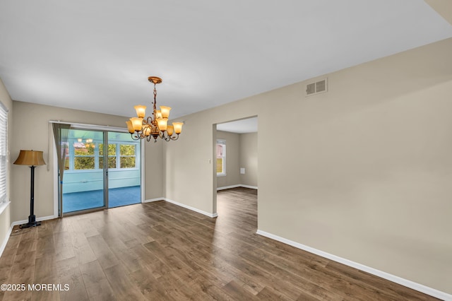 40 Everest Dr N, Brick, NJ 08724 - empty room featuring a chandelier, wood finished floors, and baseboards
