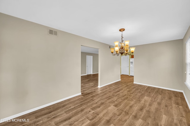 40 Everest Dr N, Brick, NJ 08724 - empty room featuring a chandelier, baseboards, and wood finished floors