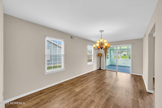 40 Everest Dr N, Brick, NJ 08724 - unfurnished room with wood finished floors, a chandelier, and baseboards