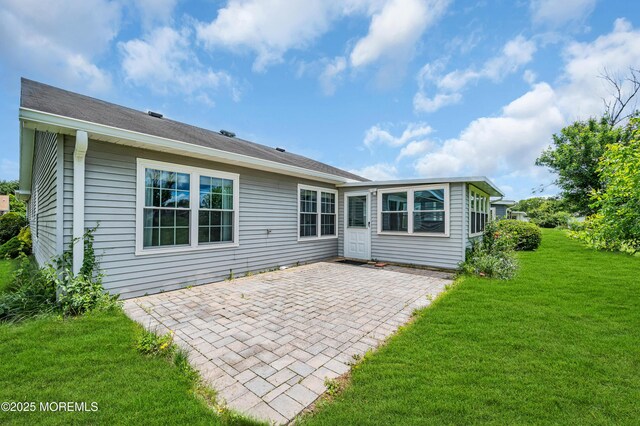 40 Everest Dr N, Brick, NJ 08724 - rear view of house featuring a patio and a lawn