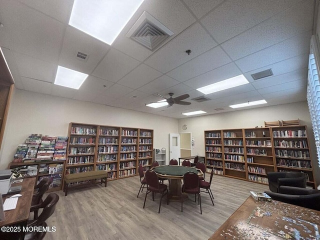 40 Everest Dr N, Brick, NJ 08724 - home office featuring bookshelves, wood finished floors, a paneled ceiling, and a ceiling fan