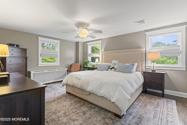 116 Manor Dr, Red Bank, NJ 07701 - bedroom featuring radiator heating unit, wood finished floors, baseboards, and a ceiling fan