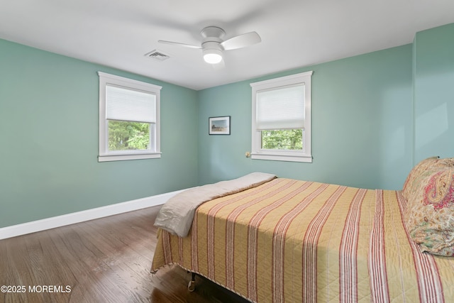 116 Manor Dr, Red Bank, NJ 07701 - bedroom featuring multiple windows, wood finished floors, baseboards, and a ceiling fan