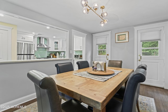 116 Manor Dr, Red Bank, NJ 07701 - dining room featuring dark wood-type flooring, a chandelier, plenty of natural light, and baseboards