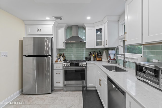 116 Manor Dr, Red Bank, NJ 07701 - kitchen featuring stainless steel appliances, wall chimney exhaust hood, a sink, light stone countertops, and white cabinetry