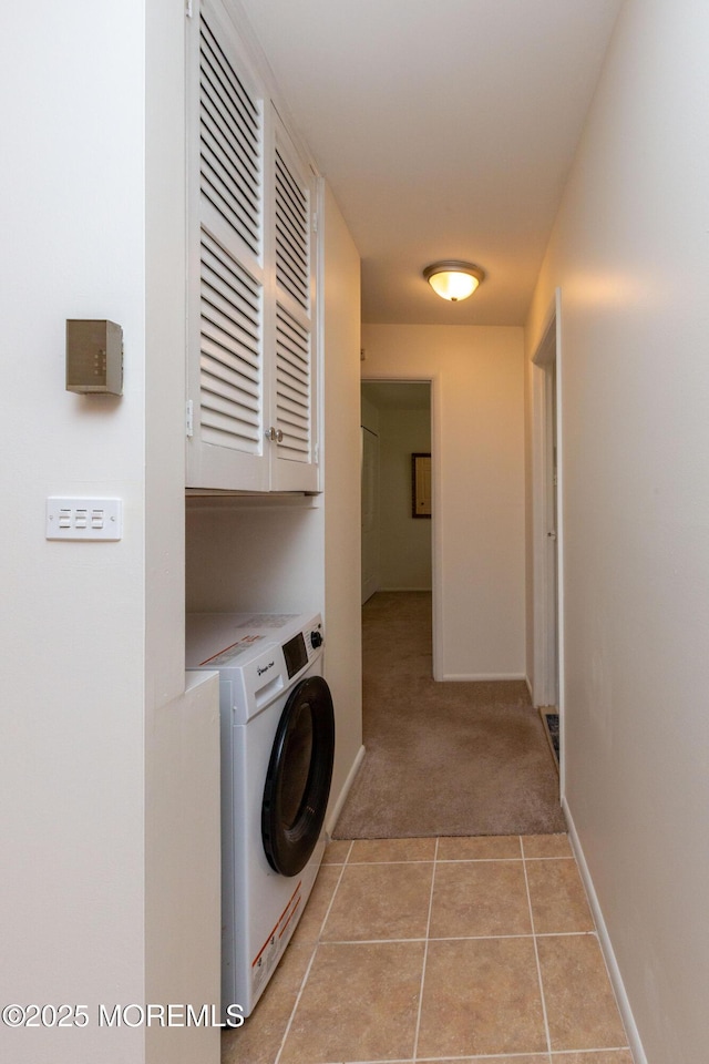 65C Dorchester Dr, Lakewood, NJ 08701 - laundry area featuring washer / clothes dryer, cabinet space, light colored carpet, and light tile patterned floors