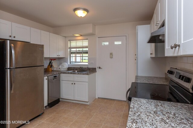 65C Dorchester Dr, Lakewood, NJ 08701 - kitchen with appliances with stainless steel finishes, ventilation hood, white cabinets, backsplash, and light stone counters