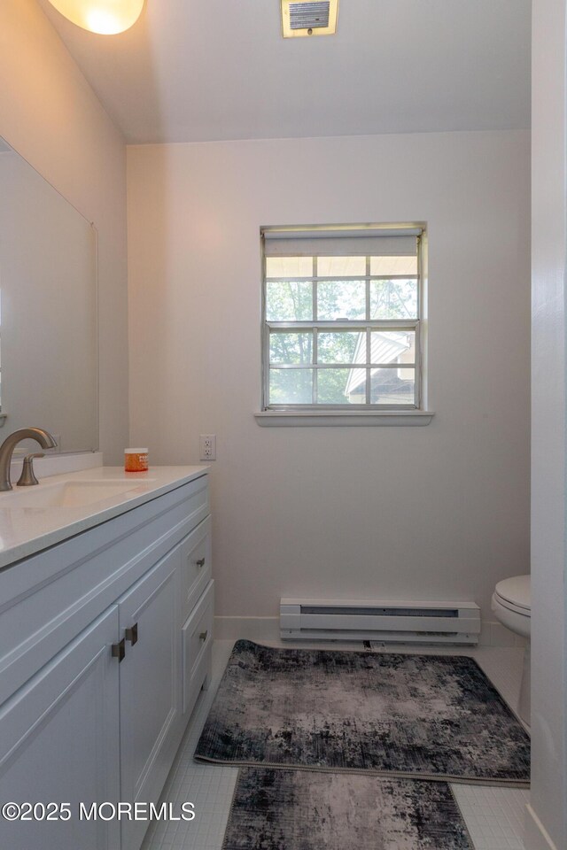 65C Dorchester Dr, Lakewood, NJ 08701 - bathroom with baseboard heating and vanity