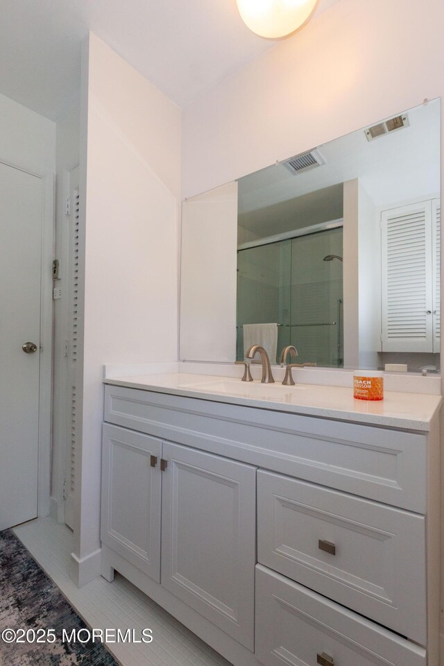 65C Dorchester Dr, Lakewood, NJ 08701 - full bath featuring vanity, a stall shower, and a closet