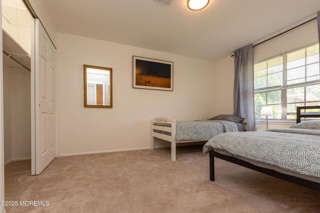 65C Dorchester Dr, Lakewood, NJ 08701 - bedroom featuring light carpet and a closet