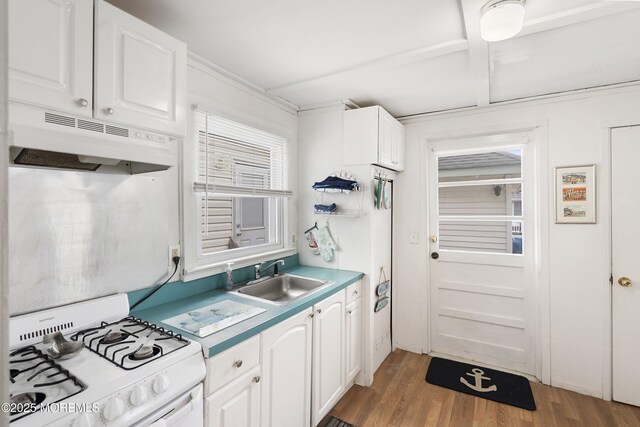 10 Brunswick Place, Point Pleasant Beach, NJ 08742 - kitchen with under cabinet range hood, a sink, white range with gas cooktop, and white cabinets