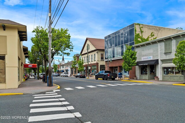 10 Brunswick Place, Point Pleasant Beach, NJ 08742 - view of asphalt road featuring sidewalks, street lighting, and curbs