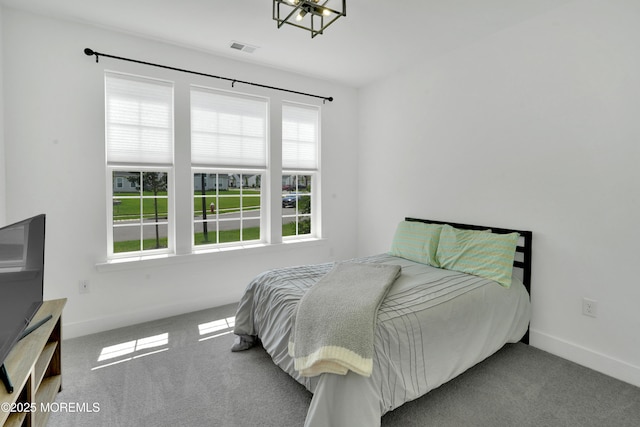 69 Starlight Dr, Monroe, NJ 08831 - carpeted bedroom with multiple windows, baseboards, and a chandelier
