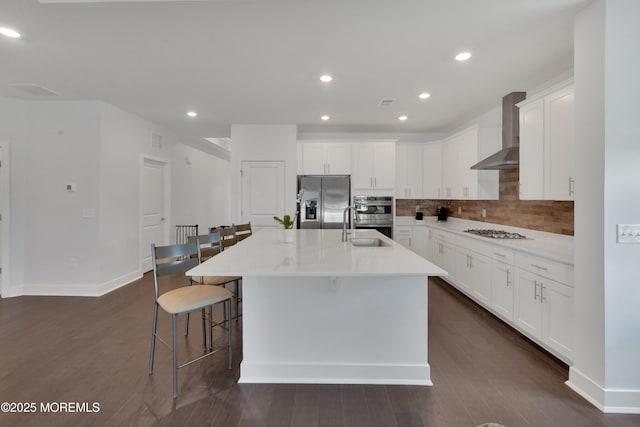69 Starlight Dr, Monroe, NJ 08831 - kitchen with wall chimney exhaust hood, appliances with stainless steel finishes, a sink, decorative backsplash, and a kitchen bar