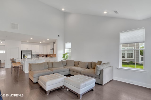 69 Starlight Dr, Monroe, NJ 08831 - living area featuring plenty of natural light, wood finished floors, recessed lighting, baseboards, and a high ceiling