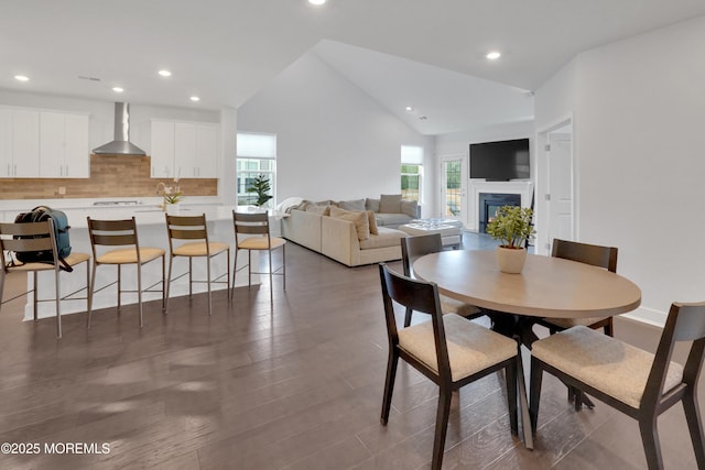 69 Starlight Dr, Monroe, NJ 08831 - dining area with vaulted ceiling, recessed lighting, wood finished floors, and a fireplace